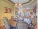 Dining room featuring a large round wooden table and a view into the living room at 401 Obsidian St, Las Vegas, NV 89145