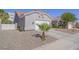Charming single-story home with a well-manicured yard, desert landscaping and a three-car garage at 401 Obsidian St, Las Vegas, NV 89145