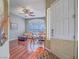 Inviting foyer with dark wood floors, fan light fixture, and view into a living room at 401 Obsidian St, Las Vegas, NV 89145