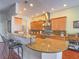 Well-equipped kitchen with granite countertops, stainless steel appliances, and breakfast bar at 401 Obsidian St, Las Vegas, NV 89145