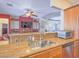 Modern kitchen featuring stainless steel sink, granite countertops, and view to the adjacent Living Room at 401 Obsidian St, Las Vegas, NV 89145