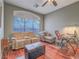 Comfortable living room featuring wood floors, fan light fixture, and a large window at 401 Obsidian St, Las Vegas, NV 89145