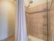 Shower with tile surround and built-in storage shelving; perfect for organization at 401 Obsidian St, Las Vegas, NV 89145