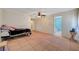 Large bedroom features tile floors, ceiling fan, and an ensuite bathroom at 4067 E Colorado Ave, Las Vegas, NV 89104
