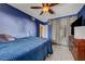 Blue bedroom featuring ample natural light, tile floor, ceiling fan, and ample space at 4067 E Colorado Ave, Las Vegas, NV 89104
