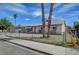 Charming single-story home with a gravel yard and mature palm trees at 4067 E Colorado Ave, Las Vegas, NV 89104