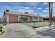 Charming single-story home with a gravel yard and mature palm trees at 4067 E Colorado Ave, Las Vegas, NV 89104