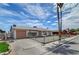 Charming single-story home with a gravel yard and mature palm trees at 4067 E Colorado Ave, Las Vegas, NV 89104