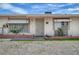 Charming single-story home with a gravel yard and mature palm trees at 4067 E Colorado Ave, Las Vegas, NV 89104