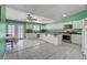 Well-lit kitchen with white cabinetry, tile floors, and modern appliances at 4067 E Colorado Ave, Las Vegas, NV 89104