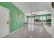 Bright kitchen and dining area featuring tile floors and green accent wall at 4067 E Colorado Ave, Las Vegas, NV 89104