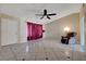Bright living room features tile flooring, neutral walls, and a cozy reading chair at 4067 E Colorado Ave, Las Vegas, NV 89104