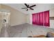 Spacious living room with tile flooring, ceiling fan, and bright natural light at 4067 E Colorado Ave, Las Vegas, NV 89104