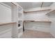 Walk-in closet featuring multiple shelves, tile floor, and bars for storage at 4067 E Colorado Ave, Las Vegas, NV 89104