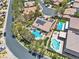 Expansive aerial view of a home featuring a private pool, well-maintained landscaping, and solar panels at 4196 Balmoral Castle Ct, Las Vegas, NV 89141
