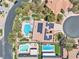 Beautiful aerial view of a home with a pool, landscaping, solar panels, and surrounding neighborhood at 4196 Balmoral Castle Ct, Las Vegas, NV 89141