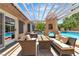 Relaxing outdoor patio with shaded seating area, built-in grill, and access to the refreshing pool at 4196 Balmoral Castle Ct, Las Vegas, NV 89141