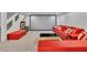 Finished basement with expansive seating, projector screen and adjacent staircase at 4196 Balmoral Castle Ct, Las Vegas, NV 89141