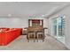 Finished basement featuring custom bar area, comfortable seating, and outdoor access at 4196 Balmoral Castle Ct, Las Vegas, NV 89141