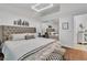 Comfortable bedroom with upholstered headboard, modern lighting, and relaxing decor at 4196 Balmoral Castle Ct, Las Vegas, NV 89141