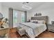 Bedroom featuring a luxurious bed, stylish accents, and plenty of natural light at 4196 Balmoral Castle Ct, Las Vegas, NV 89141