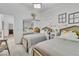 Bedroom boasts twin beds, closet with mirrored doors, and creative wall decor at 4196 Balmoral Castle Ct, Las Vegas, NV 89141