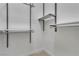 Walk-in closet with built-in shelves and rods for optimal organization at 4196 Balmoral Castle Ct, Las Vegas, NV 89141