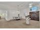 Open-concept dining room with stylish lighting, tile floors and seamless flow to other living spaces at 4196 Balmoral Castle Ct, Las Vegas, NV 89141