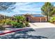 Charming single-story home with a three-car garage and well-manicured front yard landscaping at 4196 Balmoral Castle Ct, Las Vegas, NV 89141