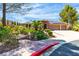 Beautiful one-story home showcasing a three-car garage, solar panels, and a well-kept lawn at 4196 Balmoral Castle Ct, Las Vegas, NV 89141