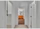 Hallway view showcases access to a walk-in closet and a bathroom with a beautiful vanity at 4196 Balmoral Castle Ct, Las Vegas, NV 89141