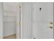 Hallway features white walls, neutral flooring, shelving, and white closet doors at 4196 Balmoral Castle Ct, Las Vegas, NV 89141