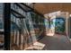 Unique patio with a spiral staircase, beach themed mural, and brick flooring for a distinctive outdoor space at 4196 Balmoral Castle Ct, Las Vegas, NV 89141