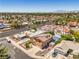 This stunning aerial view showcases a well-maintained neighborhood with pools, palm trees, and desert landscaping at 4475 Harmony Ct, Las Vegas, NV 89121