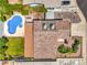 Aerial view showcasing a private pool, well-maintained lawn, and mature landscaping at 4475 Harmony Ct, Las Vegas, NV 89121