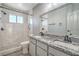 Beautifully remodeled bathroom featuring marble shower and a double sink with granite countertop at 4475 Harmony Ct, Las Vegas, NV 89121