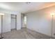 Spacious bedroom with carpet flooring, baseboards, and built in closet for ample storage at 4475 Harmony Ct, Las Vegas, NV 89121