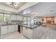 Stylish kitchen with light cabinets, granite countertops, and open access to the living room at 4475 Harmony Ct, Las Vegas, NV 89121