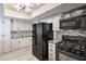 Well-equipped kitchen with stainless steel appliances, light gray cabinetry, and stone backsplash at 4475 Harmony Ct, Las Vegas, NV 89121