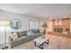Cozy living room with a brick fireplace, comfortable seating, and lots of natural light at 4475 Harmony Ct, Las Vegas, NV 89121