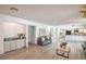Open floor plan showcasing a spacious living room with a bar area and a modern kitchen at 4475 Harmony Ct, Las Vegas, NV 89121