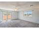 Comfortable main bedroom boasts natural light from windows and a double door entry to balcony at 4475 Harmony Ct, Las Vegas, NV 89121