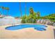 Inviting pool area with ample space and clear blue water perfect for summertime enjoyment at 4475 Harmony Ct, Las Vegas, NV 89121