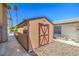 Durable shed with an appealing exterior for convenient storage of outdoor equipment or creating a hobby space at 4475 Harmony Ct, Las Vegas, NV 89121