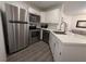 Modern kitchen with stainless steel appliances, sleek countertops, and ample cabinet space at 460 Elm Dr # 103, Las Vegas, NV 89169