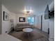 Inviting living room featuring modern lighting, neutral tones, and a comfortable seating arrangement at 460 Elm Dr # 103, Las Vegas, NV 89169