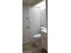 Cozy bathroom featuring a white toilet, tiled floors, and a bright skylight at 4760 Woodridge Rd, Las Vegas, NV 89121