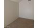 Neutral colored bedroom with plush carpeting and bright, white walls at 4760 Woodridge Rd, Las Vegas, NV 89121