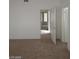 Spacious bedroom featuring neutral carpet and a view of the open doorway at 4760 Woodridge Rd, Las Vegas, NV 89121