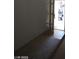 Entryway from garage into the house showing transition from tile to carpet at 4760 Woodridge Rd, Las Vegas, NV 89121